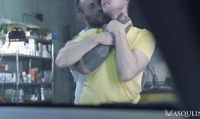 Van Mechanic boinks fellow At Workshop