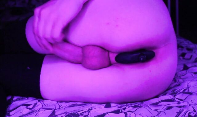 A fellow with a plaything in the backside jerks