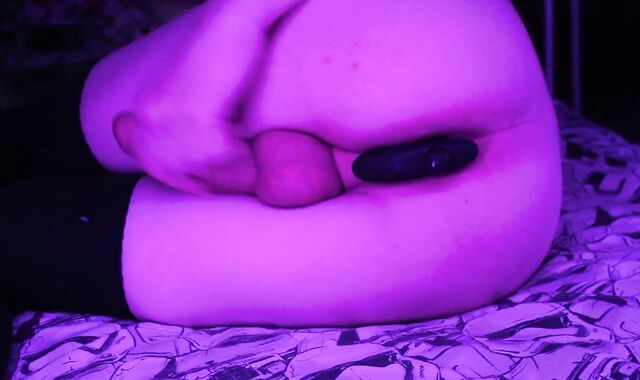 A fellow with a plaything in the backside jerks