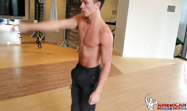 AmericanMuscleHunks: Gymnast Logan clad in uniform opening up