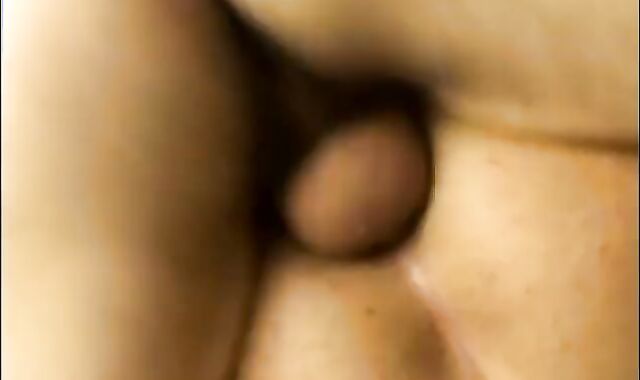 boy Making Enjoy To another Masculine On The Patio's Milky Stool