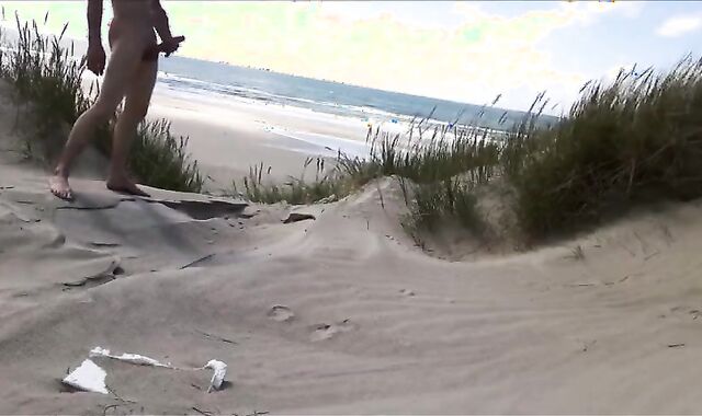 Exhibitionist Strokes Hard on the Beach