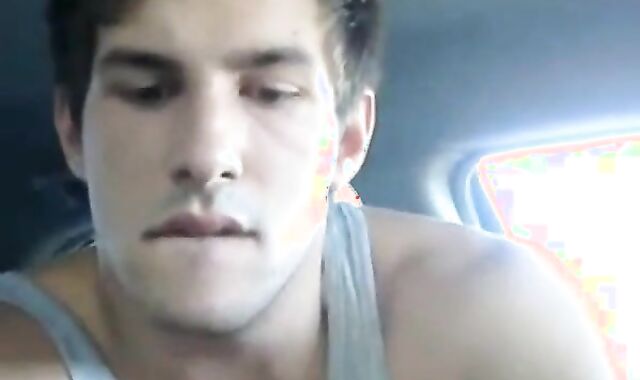 Big-cock jock strokes in his car