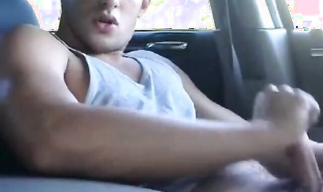 Big-cock jock strokes in his car