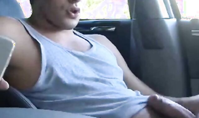 Big-cock jock strokes in his car