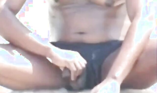 Black Amateur Strokes His Big Cock Outdoors at the Beach