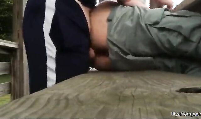 Bareback anal cumming on an outdoor bench.