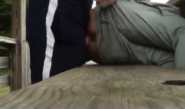 Bareback anal cumming on an outdoor bench.