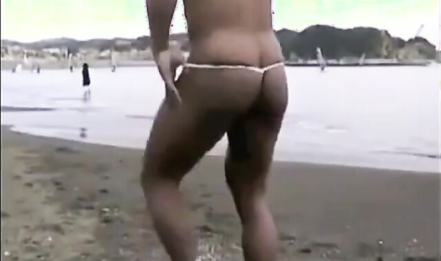 Muscled Asian Stud Bares Almost All at the Beach