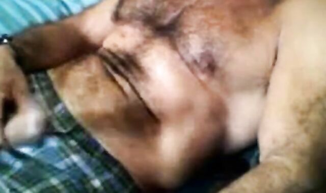 Bearded daddy strokes his cock solo