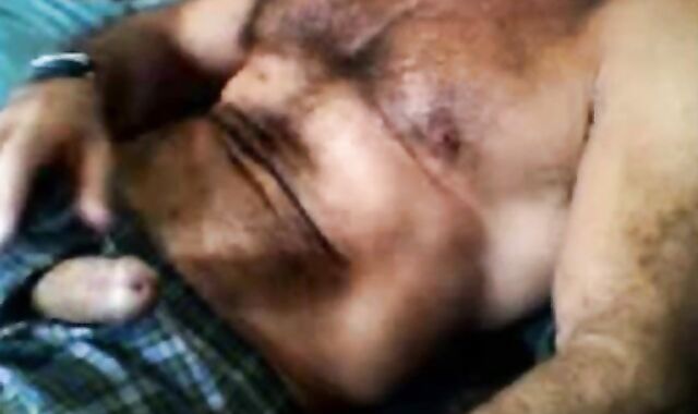 Bearded daddy strokes his cock solo