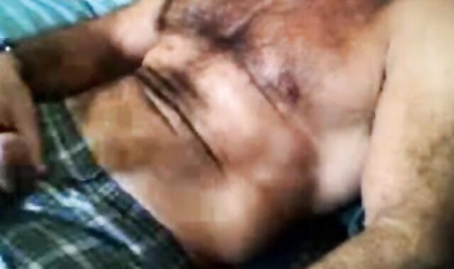 Bearded daddy strokes his cock solo