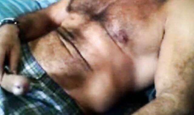 Bearded daddy strokes his cock solo