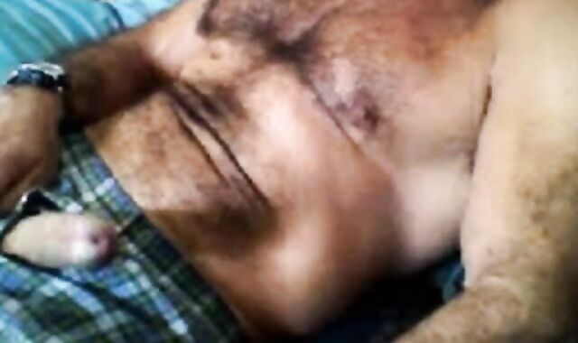 Bearded daddy strokes his cock solo