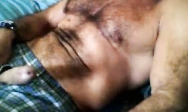 Bearded daddy strokes his cock solo