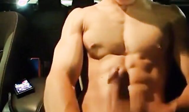 Big-Cocked Man Strokes in Car While Watching Porn