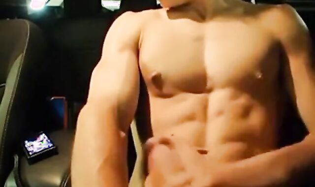 Big-Cocked Man Strokes in Car While Watching Porn