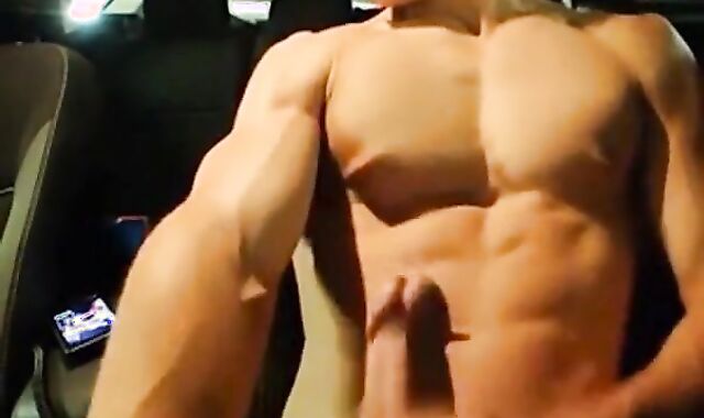 Big-Cocked Man Strokes in Car While Watching Porn