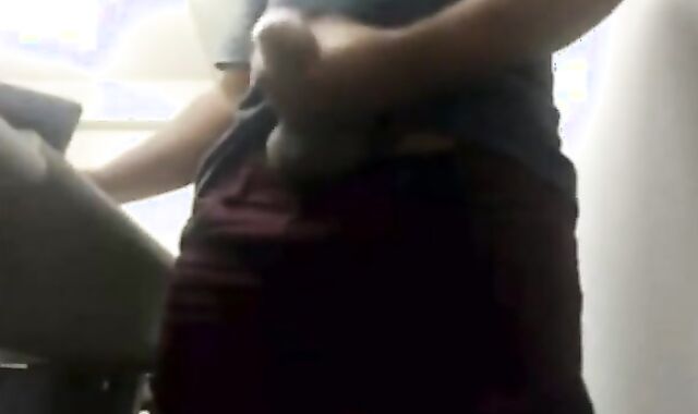 Brazilian Daddy Strokes His Big Uncut Cock at Work