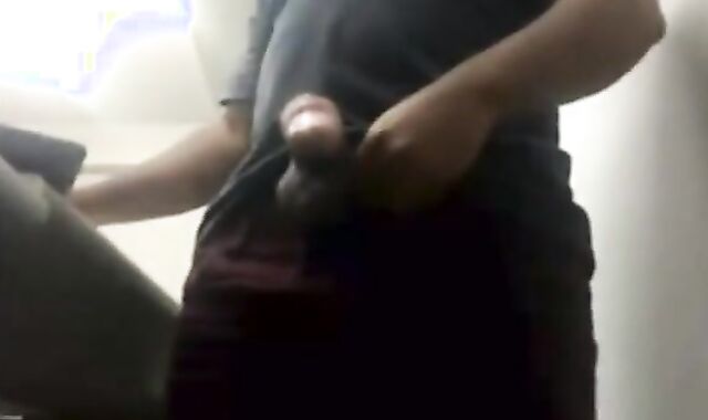 Brazilian Daddy Strokes His Big Uncut Cock at Work