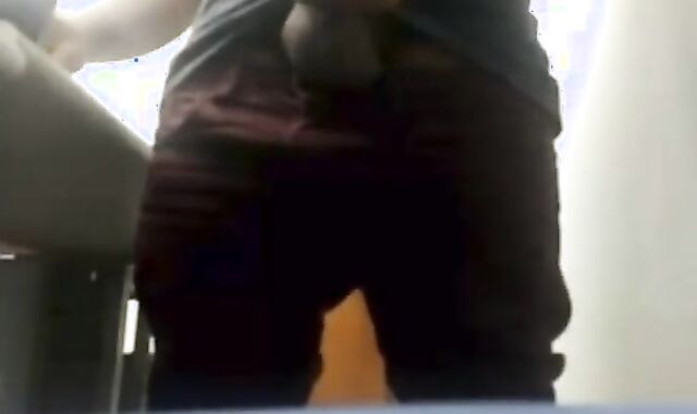 Brazilian Daddy Strokes His Big Uncut Cock at Work