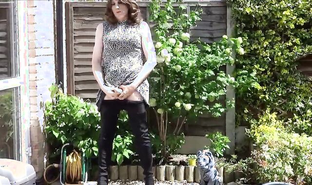 Thigh-booted Crossdresser Strokes Outdoors