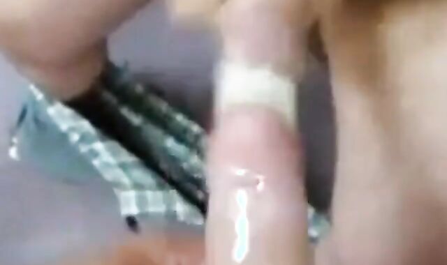 Two Guys Cum Together in a Condom