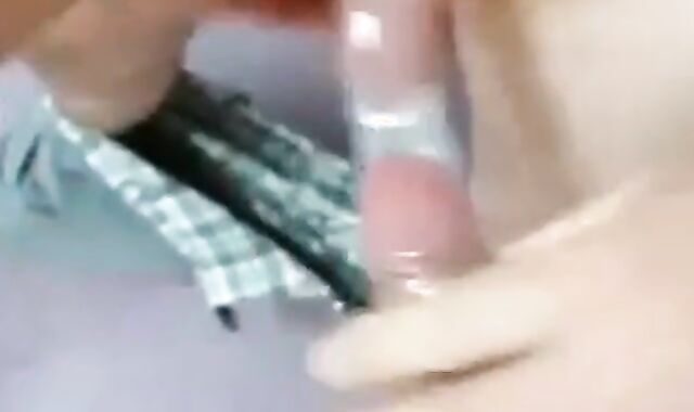 Two Guys Cum Together in a Condom