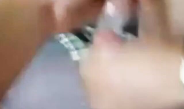 Two Guys Cum Together in a Condom