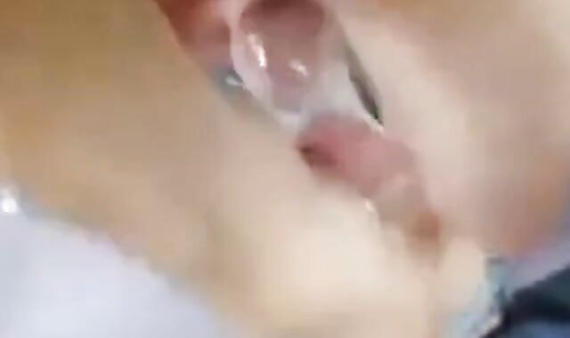 Two Guys Cum Together in a Condom