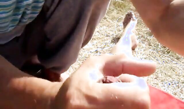 Old Man Blows Friend on Beach