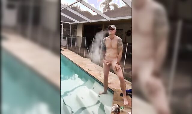 Muscular Hunk Jerks Off by the Pool with a Cigarette
