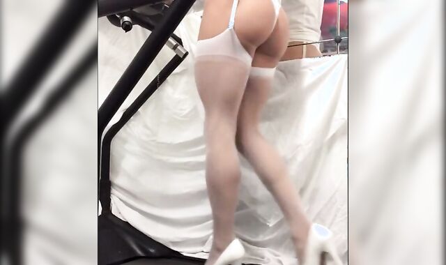 Crossdresser in White Stockings on Treadmill