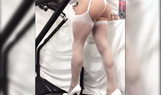 Crossdresser in White Stockings on Treadmill