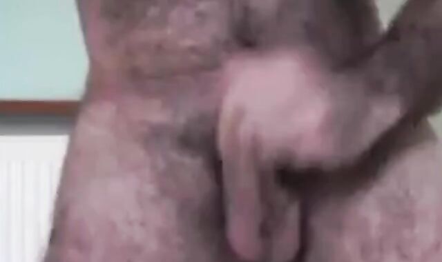 Hairy Daddy Strokes His Cock