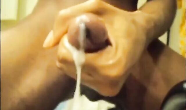 Black guy jacks off his big cock and cums hard