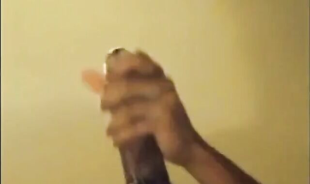 Black guy jacks off his big cock and cums hard