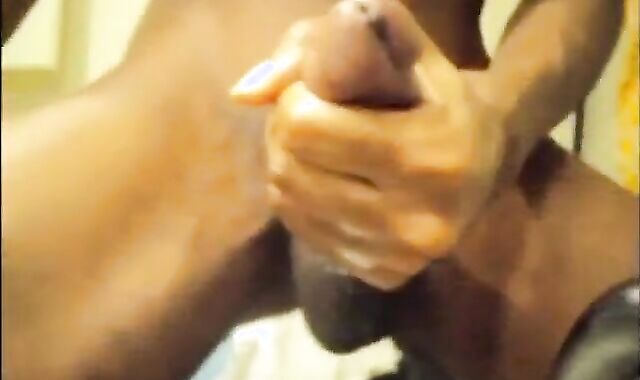 Black guy jacks off his big cock and cums hard