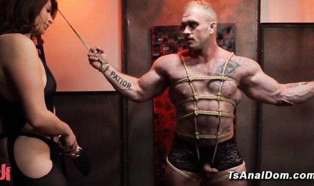 Shemale punishes bound muscle stud