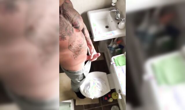 Tattooed Hunk Strokes His Big Cock Alone