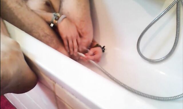 Twink Uses Shower Head for Enema and Masturbates